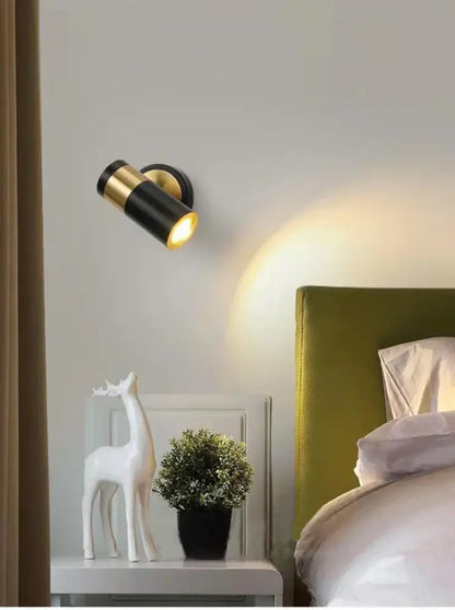 Black and gold wall lamp with sleek cylindrical design is a decorbites adjustable nordic led for modern bedroom lighting