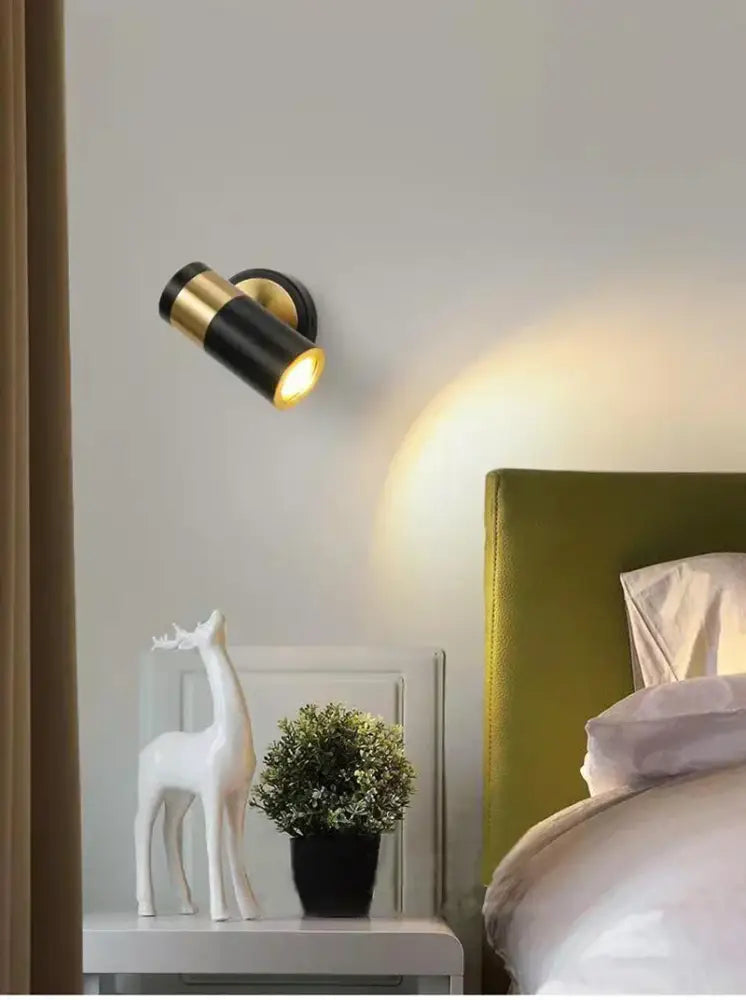 Black and gold wall lamp with sleek cylindrical design is a decorbites adjustable nordic led for modern bedroom lighting