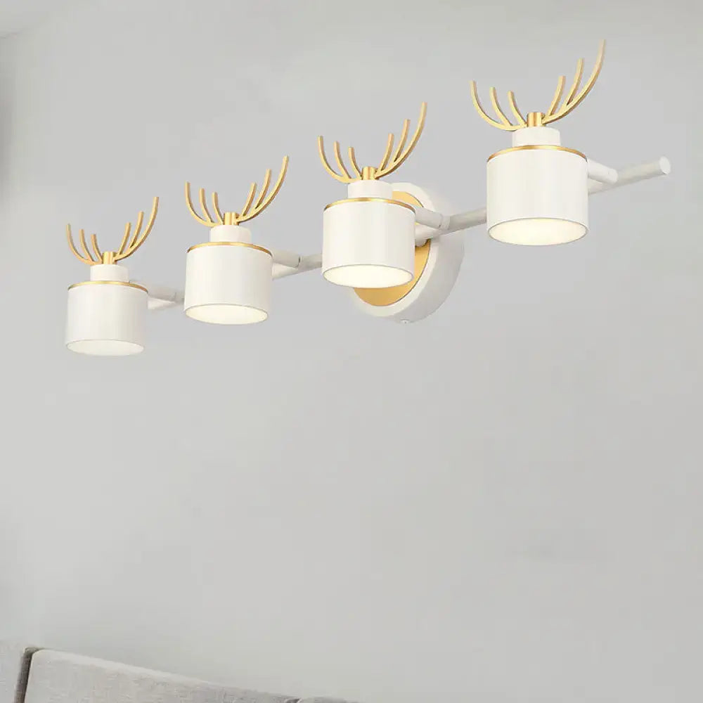 Modern white and gold antler wall light fixture with cylindrical design ideal for bathroom vanity lighting
