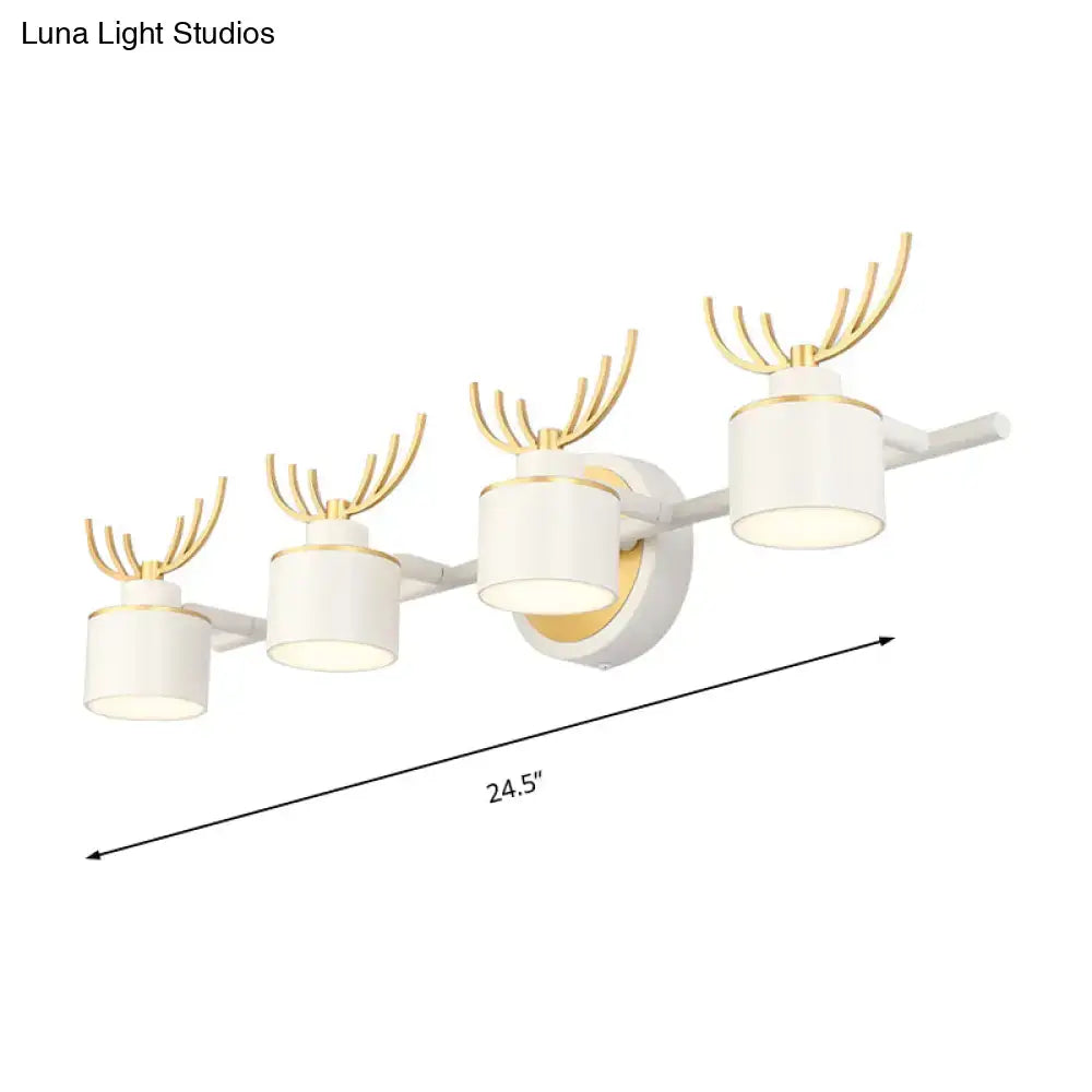 Modern white and gold deer-themed wall light fixture with four cylindrical shades for natural light in bathroom vanity