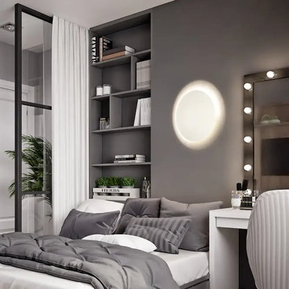 Modern white and gold circular led wall light with warm white illumination for bedroom featuring soft glowing ring