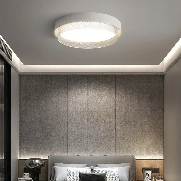 Modern white and gold circular metal grid ceiling light with textured perforated outer ring and smooth diffuser decorbites ceiling light