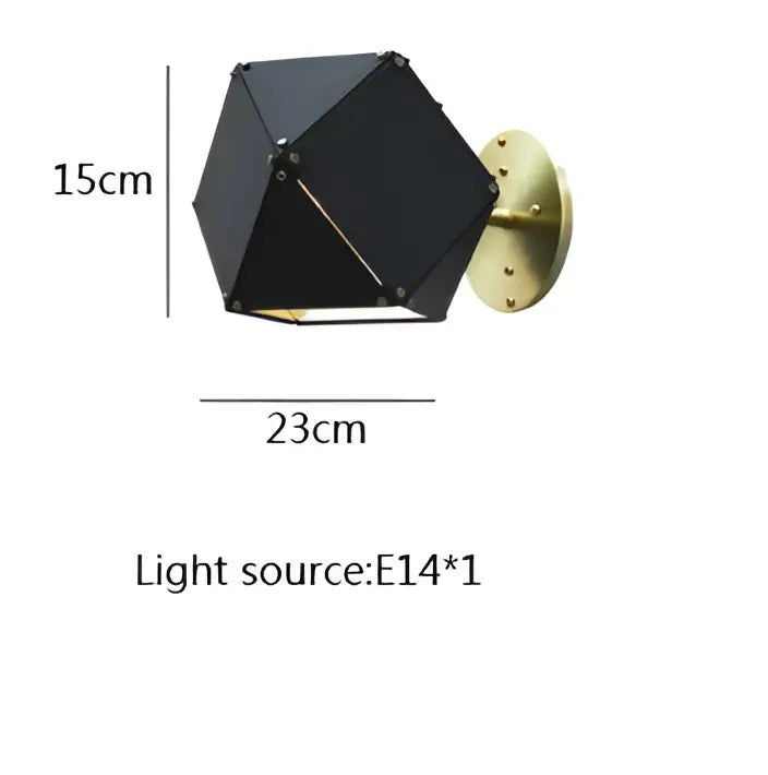 Black geometric wall sconce with brass mounting plate and gold-toned trim complements decorbites cube led pendant light