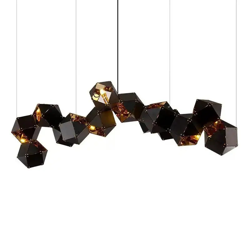 Black faceted geometric pendant light with warm interior lighting for modern white and gold decorbites cube led pendant use