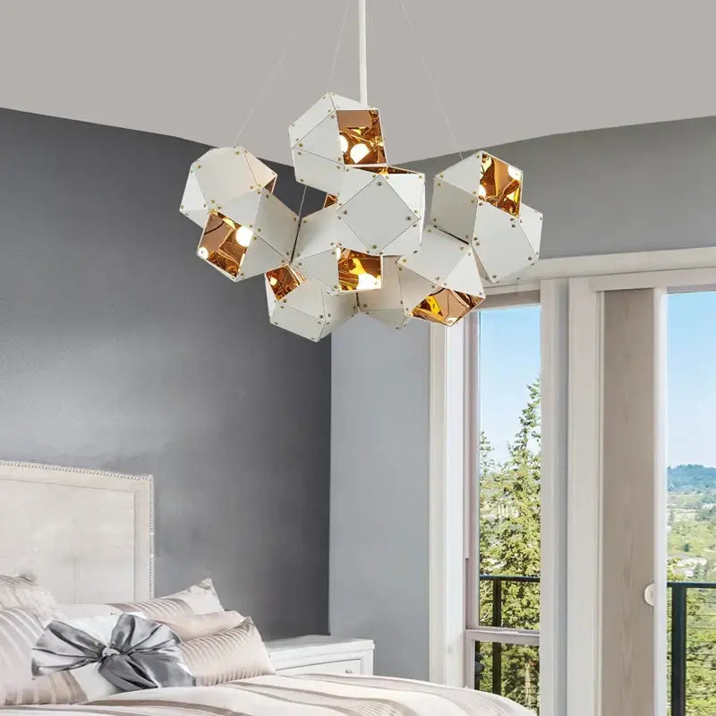 A modern white and gold metallic geometric decorbites cube led pendant light suspended for dining room decor