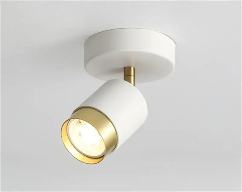 Modern white and brass decorbites ceiling chandelier with sleek cylindrical spotlight design for living room lighting