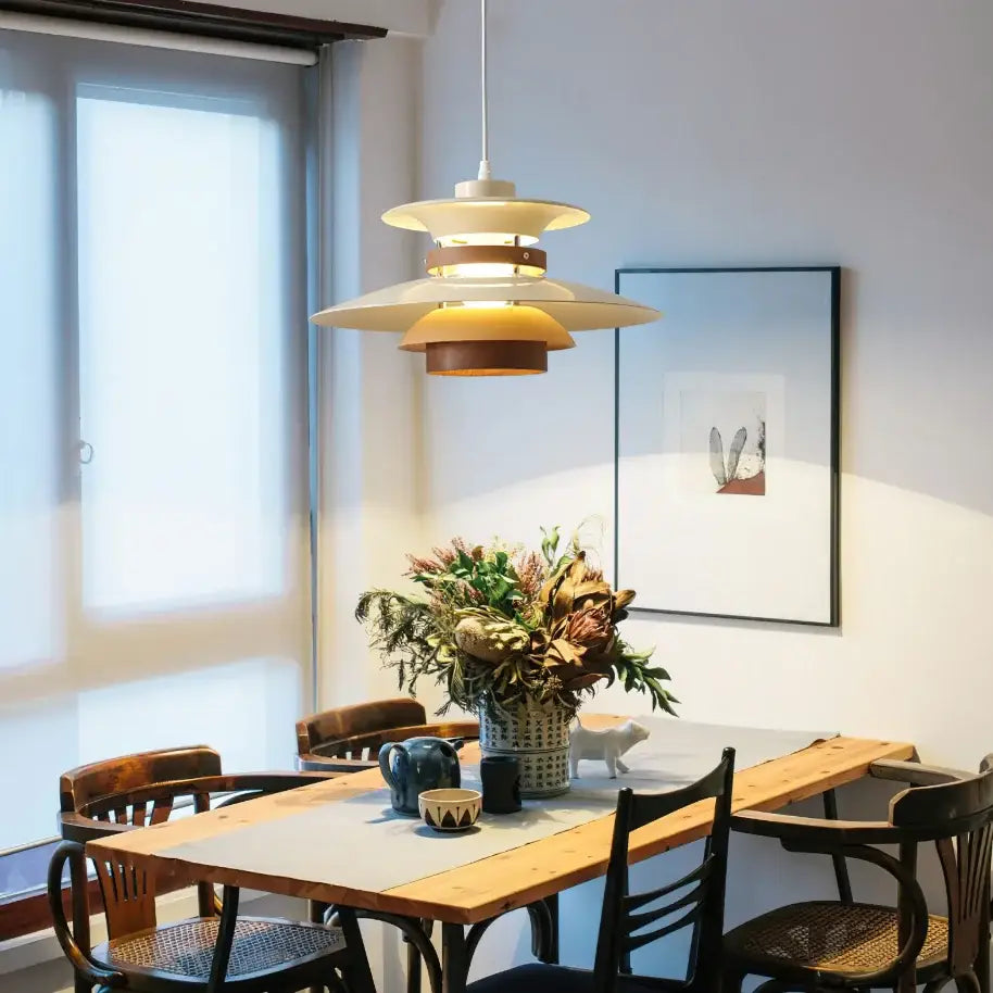 Modern white and gold designer pendant light cream-colored tiered pendant light with wooden accents above dining table decorbites designer pendant