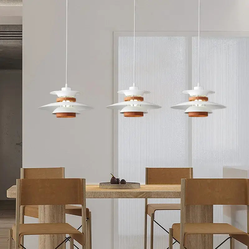 Modern white and gold designer pendant light with copper-toned layered shades for living room decorbites designer pendant light