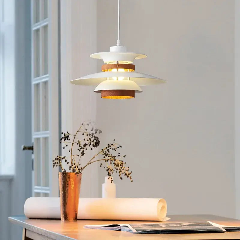 Modern white and wood-toned decorbites designer pendant light with layered tiered design for living room decor