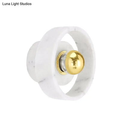 Modern white marble designer wall sconce with polished gold spherical accent ideal for bedroom lighting