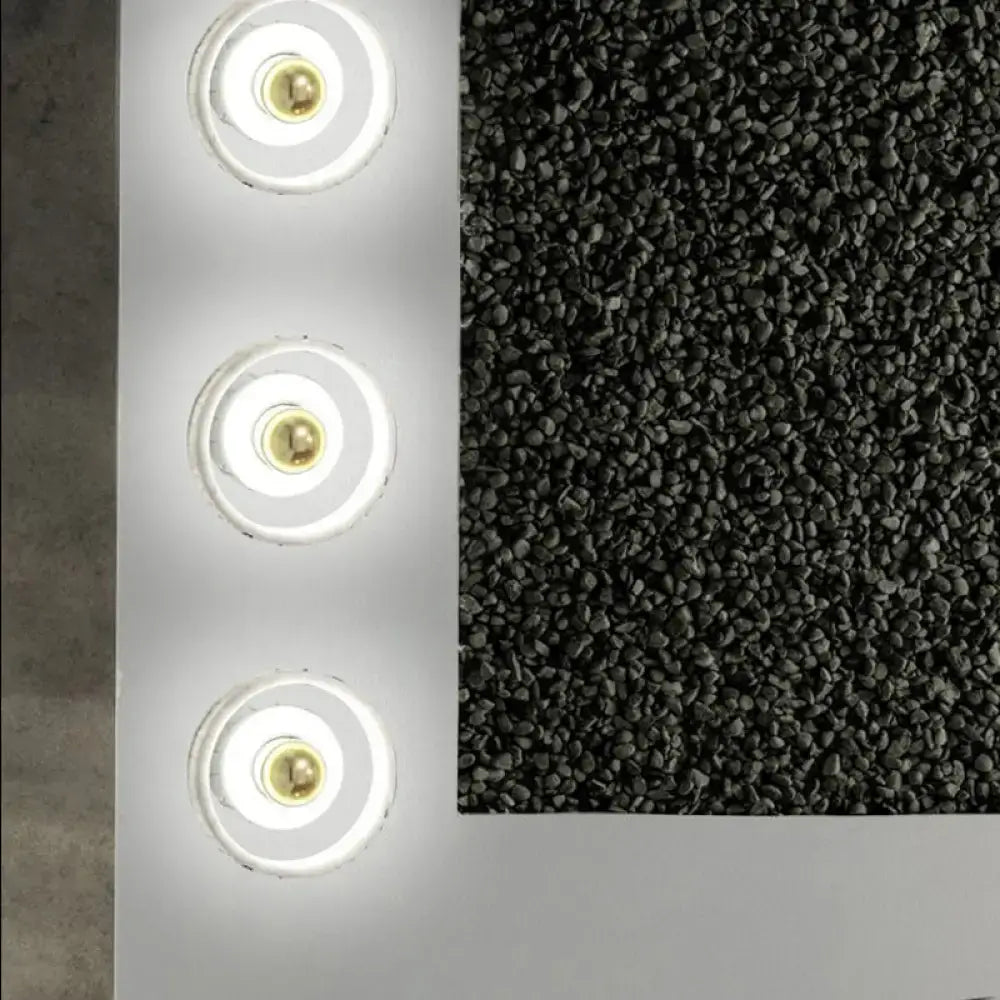 A sleek modern white and gold designer wall led light panel with three circular warm glow fixtures for bedroom use