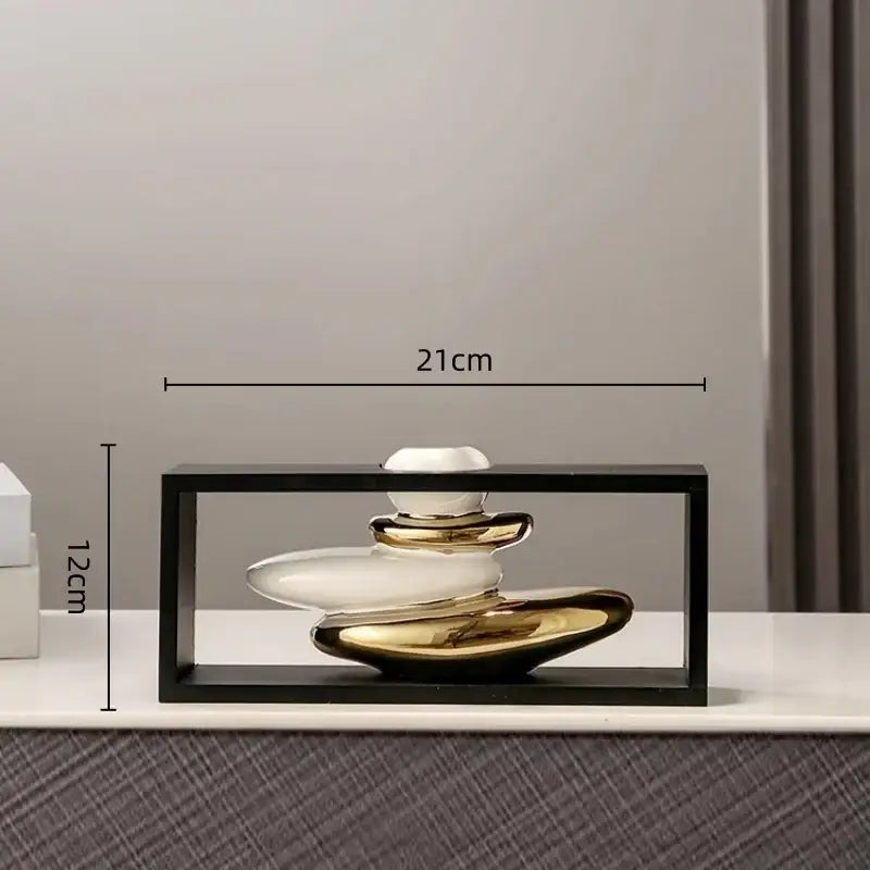 A sleek modern ceramic geometric golden rockery vase set with stacked white and gold stones for living room decor