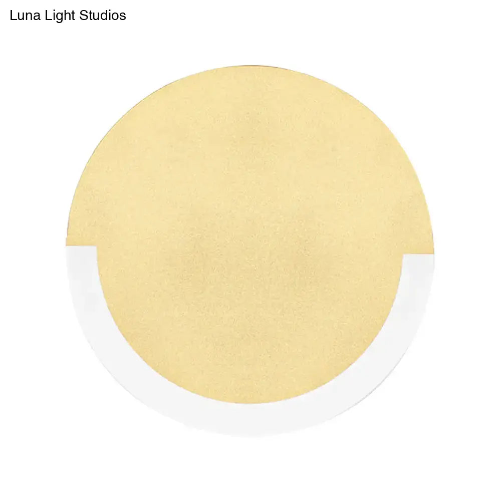 Gold-colored circular cushion with white adhesive border for modern white and gold round acrylic wall sconce warm white light