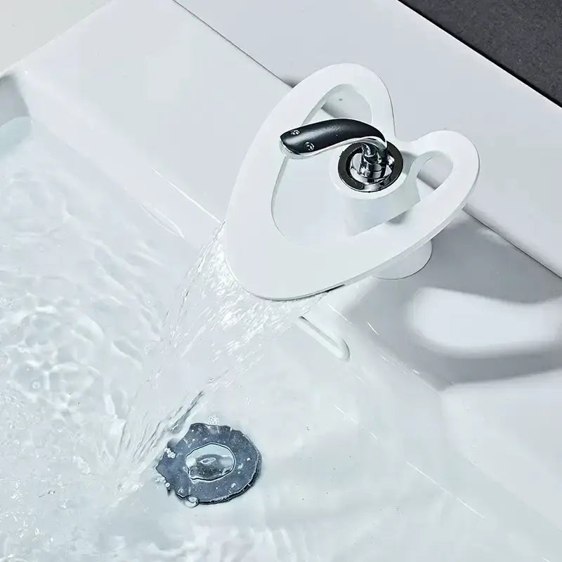 Modern white and gold waterfall basin faucet with sleek white ceramic body and black brass handle by decorbites golden white