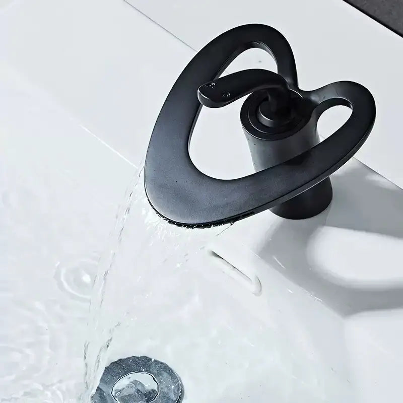 Modern white and gold waterfall basin faucet featuring a black brass snake-shaped matte finish by decorbites golden white
