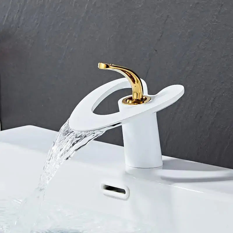 Modern white basin faucet with sleek curved spout and gold black brass handle from decorbites golden white collection