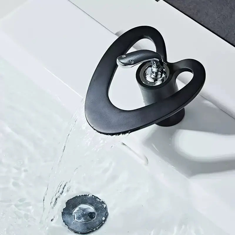 Black matte-finish snake-shaped basin faucet with polished chrome spout and handle for decorbites golden white sink