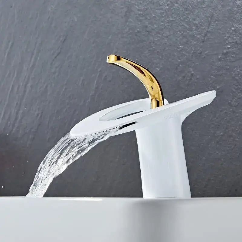 Modern white and gold waterfall basin faucet with gold finish and sleek ceramic base by decorbites golden white