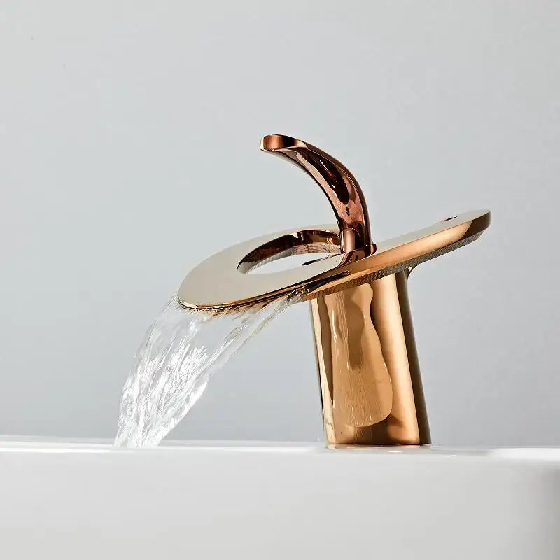 Modern white and gold basin faucet in rose gold with black brass finish and sleek waterfall design by decorbites golden white