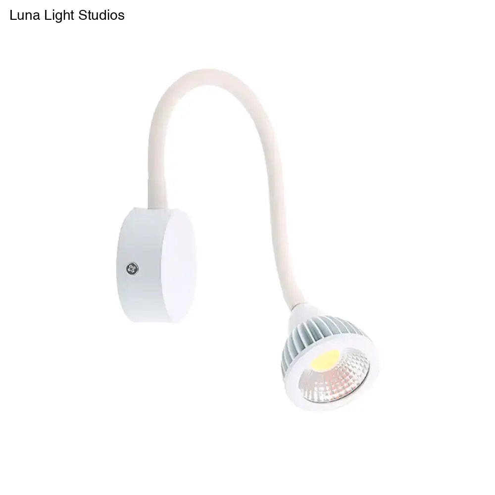 Modern white gooseneck wall sconce light with flexible arm and ribbed circular head for direct wired electric bedroom reading