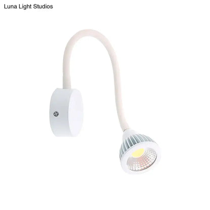 Modern white gooseneck wall sconce light with flexible arm and ribbed circular head for direct wired electric bedroom reading