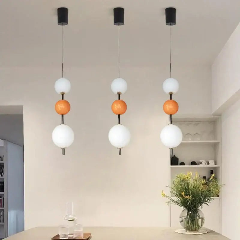 Modern white and gray glass pendant light with decorbites colorful ball led featuring black mounts and three spherical globes
