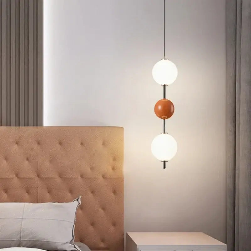 Modern pendant light with three spherical white and terracotta glass globes on chrome rods for dining room decorbites colorful ball led
