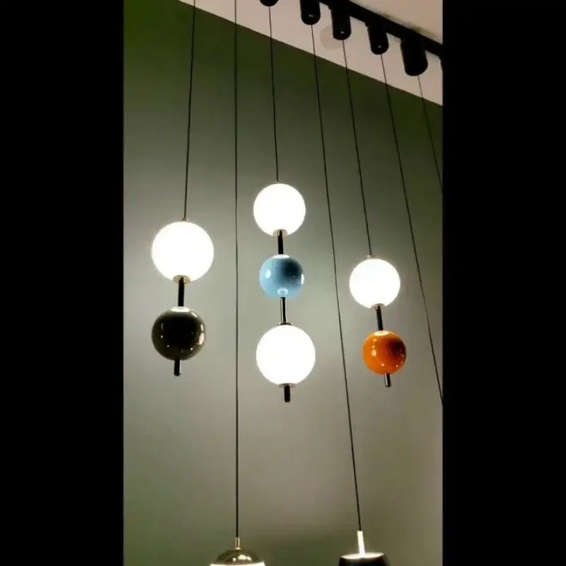 Modern white and gray glass pendant light with decorbites colorful ball led orbs in white black blue and orange for dining room decor