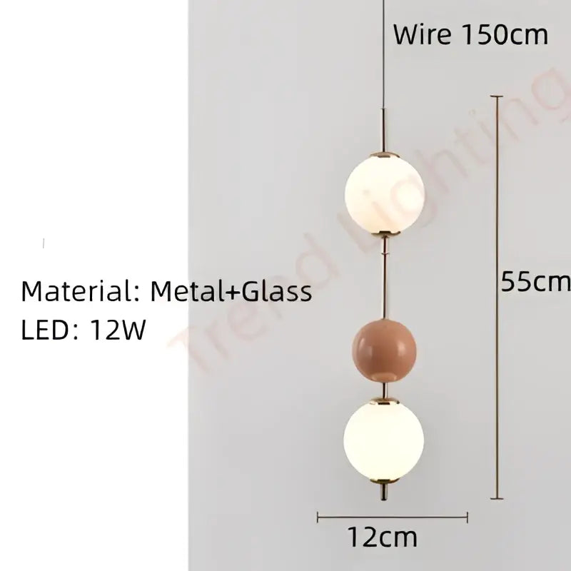 A modern pendant light with three spherical glass globes in white and terracotta by decorbites colorful ball led