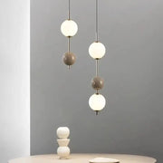 Modern white and gray glass pendant light with spherical shades and slender metal rods for dining room decorbites colorful ball led