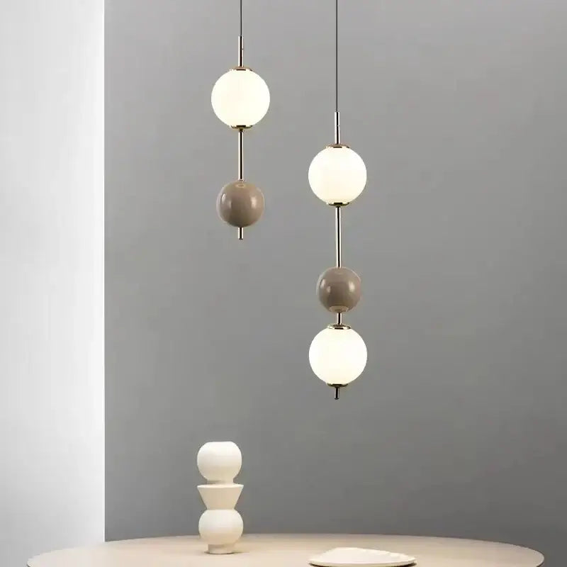 Modern white and gray glass pendant light with spherical shades and slender metal rods for dining room decorbites colorful ball led