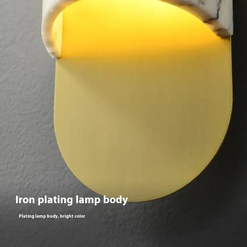 Bright yellow iron-plated wall lamp with sleek curved design for modern white and gray marble led wall lamp living room