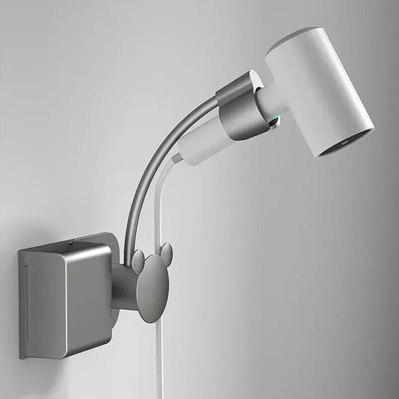 Silver mickey mouse-themed adjustable wall lamp with metallic finish and white head in modern bathroom hair dryer rack decorbites