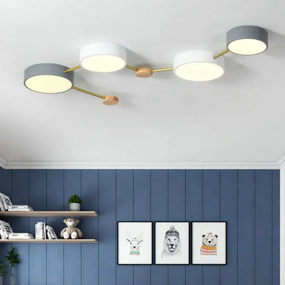 Modern white and gray wood ceiling chandelier with three circular shades and gold-toned metal arms for living room lighting