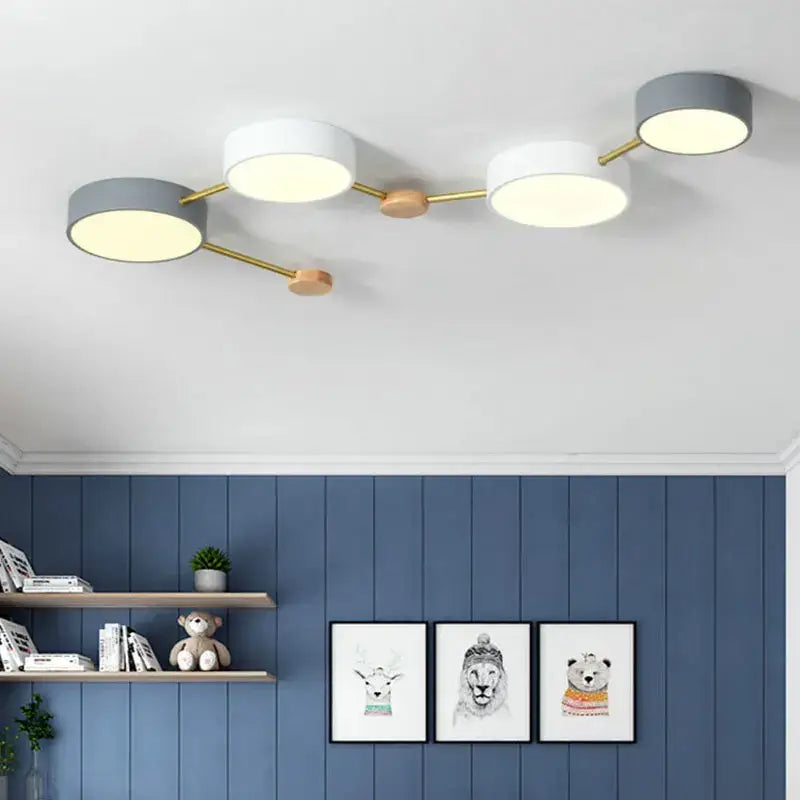 Modern white and gray wood ceiling chandelier with three circular shades and gold-toned metal arms for living room lighting