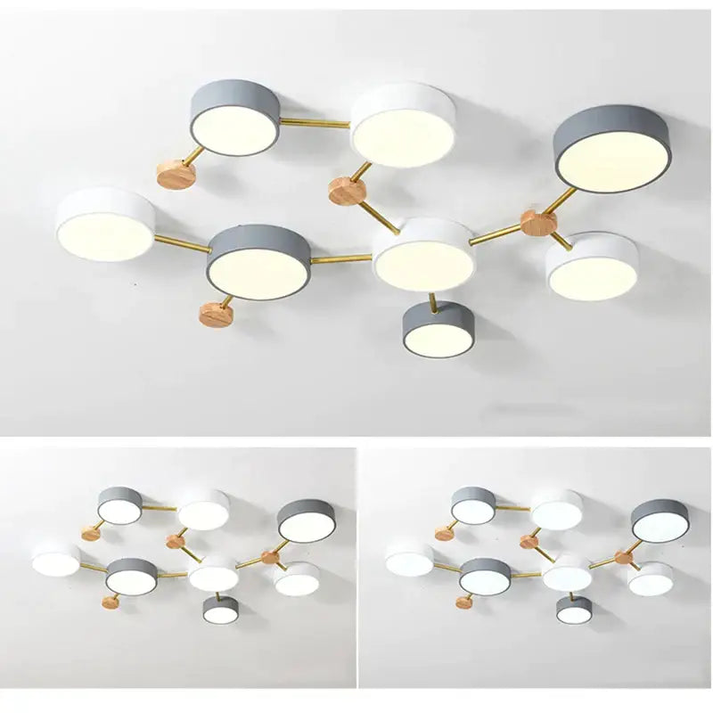 Modern white and gray wood ceiling chandelier with circular shades and gold-toned metal arms for living room lighting