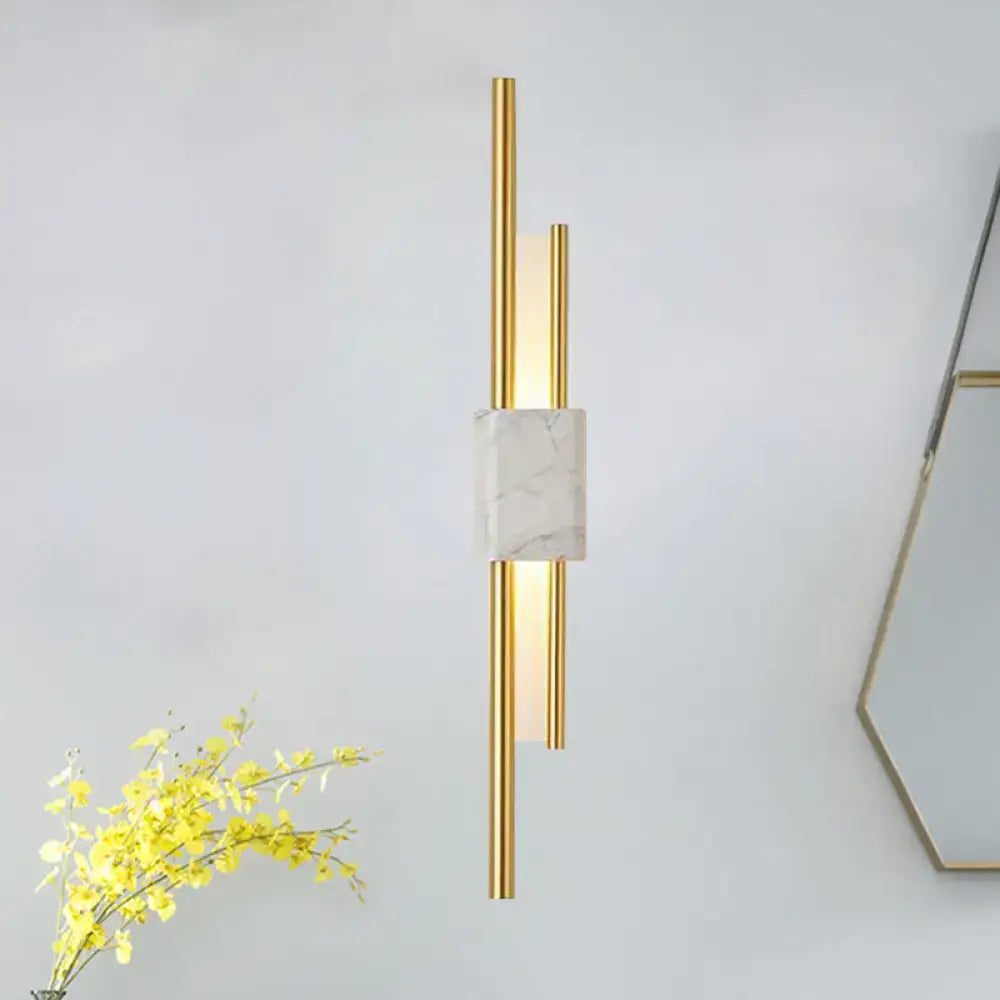 Modern white and green marble wall lamp with gold tones and cylindrical arms energy efficient and cost effective light