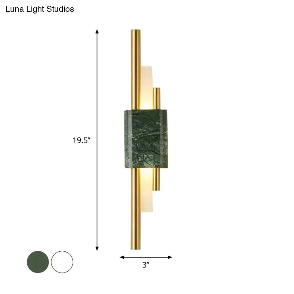 Modern white and green marble wall lamp with sleek gold frame and energy efficient vertical light tubes for bedrooms