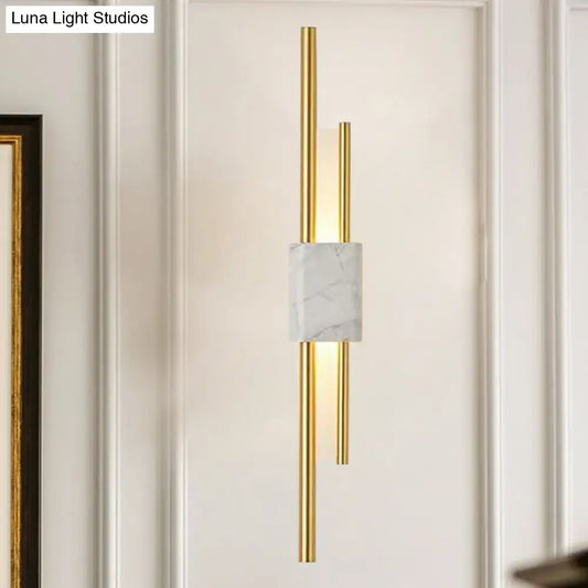 Modern white and green marble wall lamp featuring slender gold-toned rods is an energy efficient and cost effective wall lamp