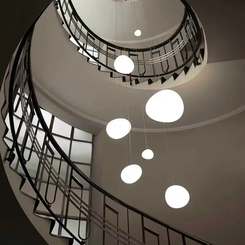 Modern white gregg glass suspension pendant light with spherical design hanging in villa staircase decorbites pendant light