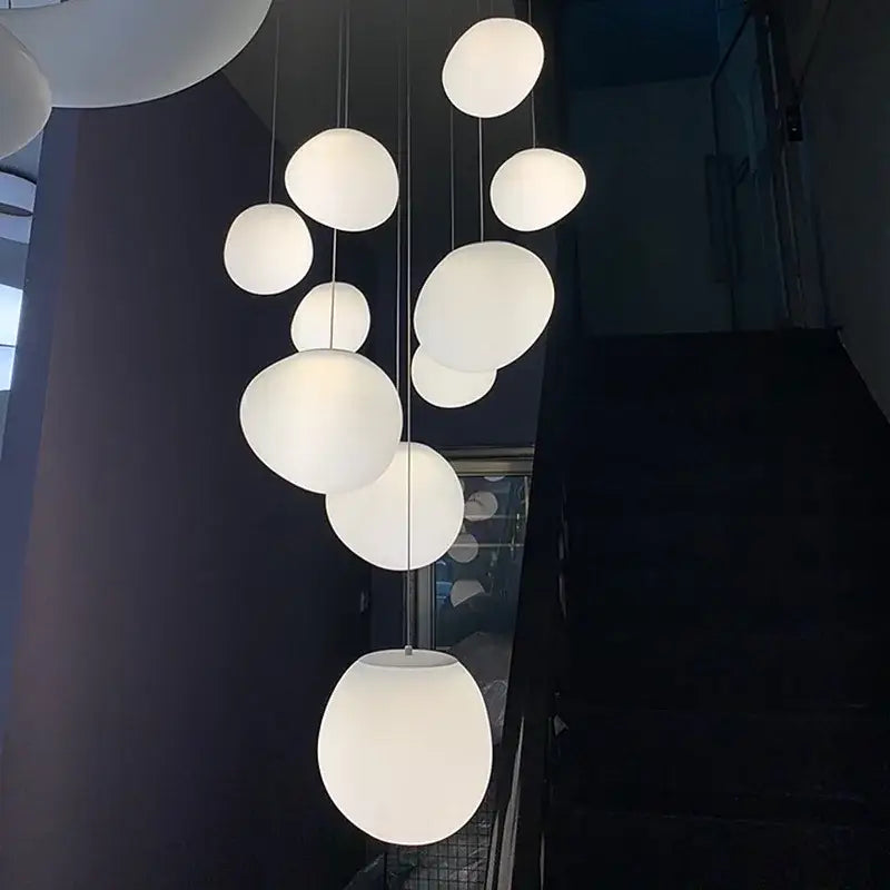 Modern white gregg glass suspension pendant light with minimalist spherical design in an elegant cluster for villa staircase decorbites gregg glass pendant light