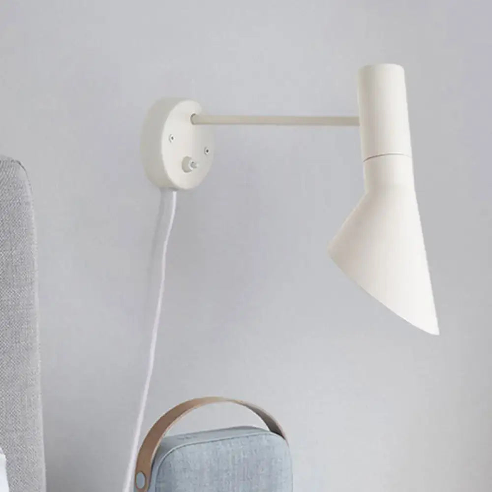 Minimalist white grey rotating node wall sconce with a cylindrical shade and slender arm for bedroom lighting