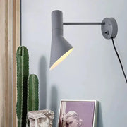 Modern white grey rotating node wall sconce with a sleek gray conical shade for bedroom lighting