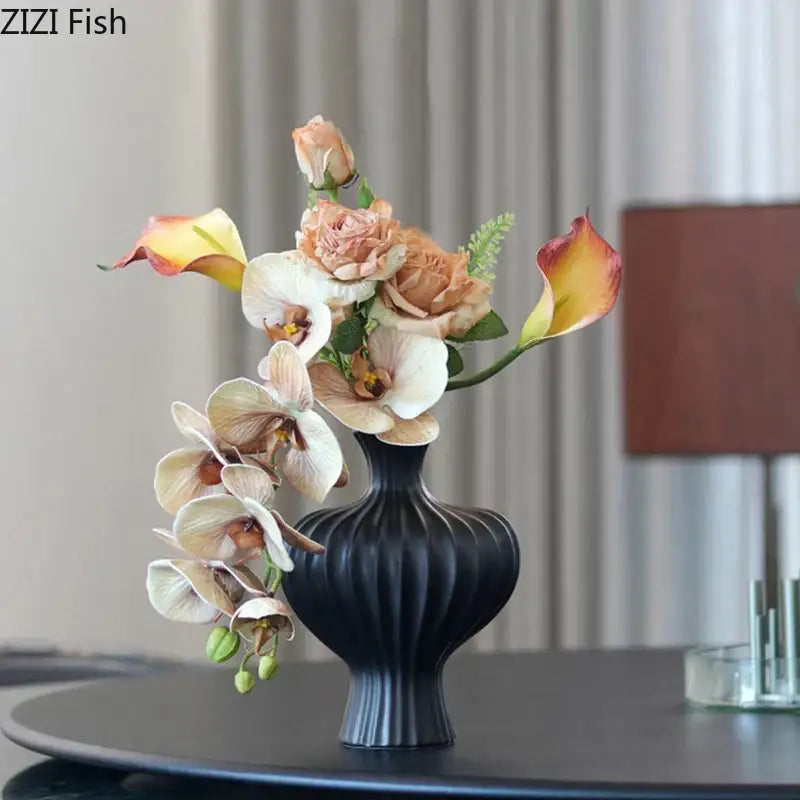 Modern white heart ceramic vase with black ribbed vase holding peach cream and yellow calla lilies for decorbites heart decor