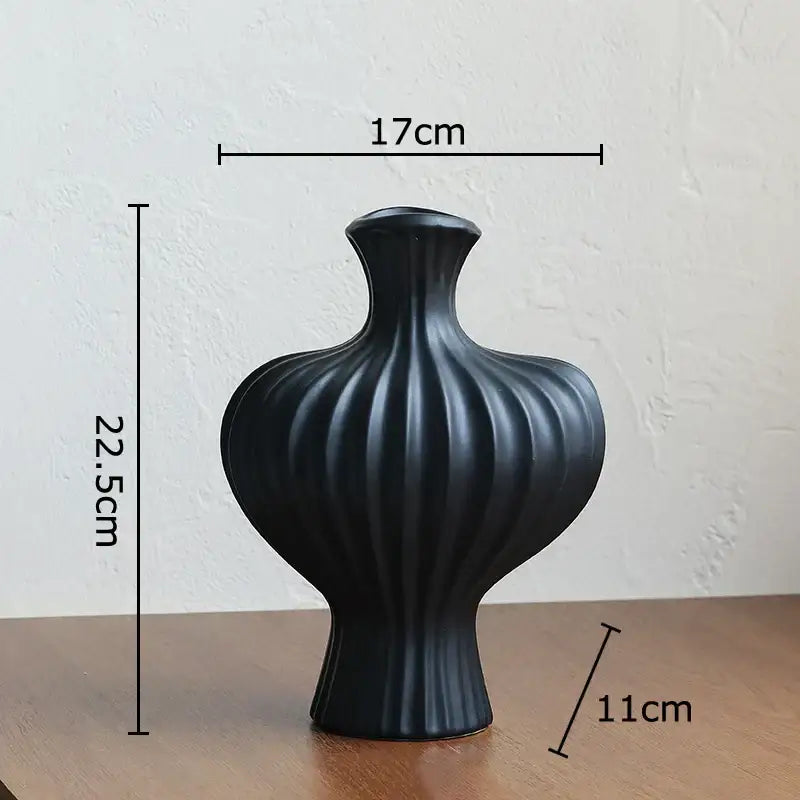 Black ceramic heart ceramic vase with vertical ribbed texture and flared neck for modern decorbites heart decor