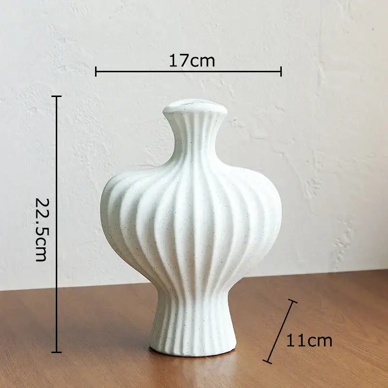 Modern white heart ceramic vase with vertical ridges and speckled finish by decorbites heart for living room decor