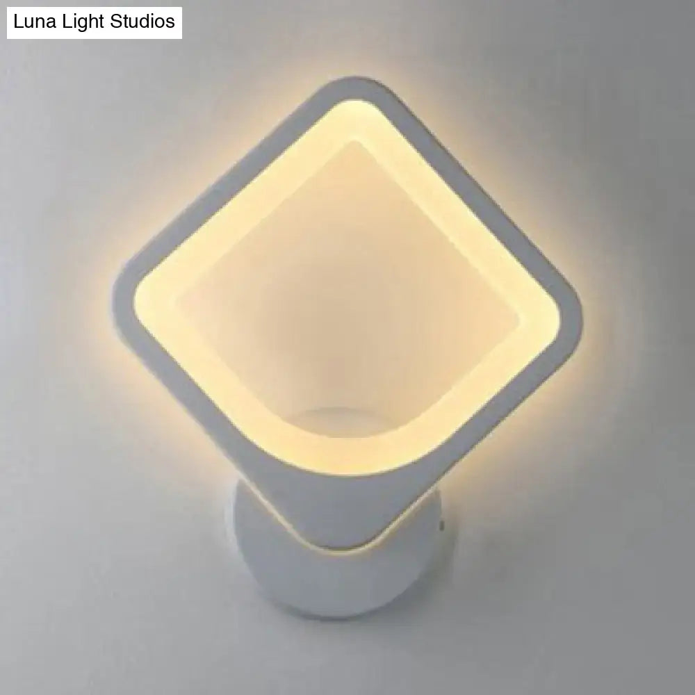 Modern white heart led wall sconce with diamond shape and warm glowing light for minimalist bedroom lighting
