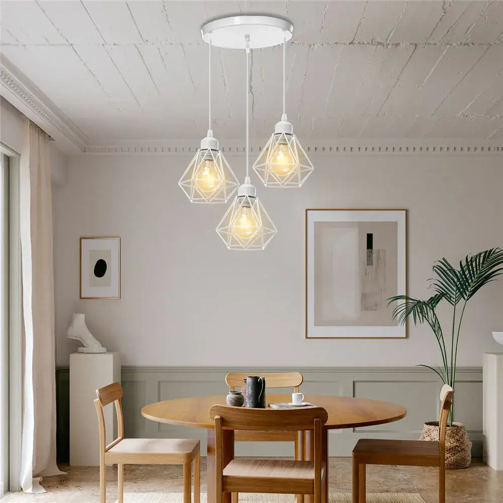 Three white decorbites iron cage pendant lights with faceted geometric design for kitchen and living room decor