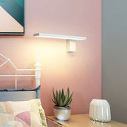 Modern white l-shaped led wall sconce with sleek rectangular design and geometric base for living room lighting
