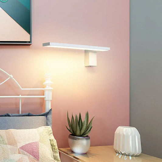 Modern white l-shaped led wall sconce with sleek rectangular design and geometric base for living room lighting
